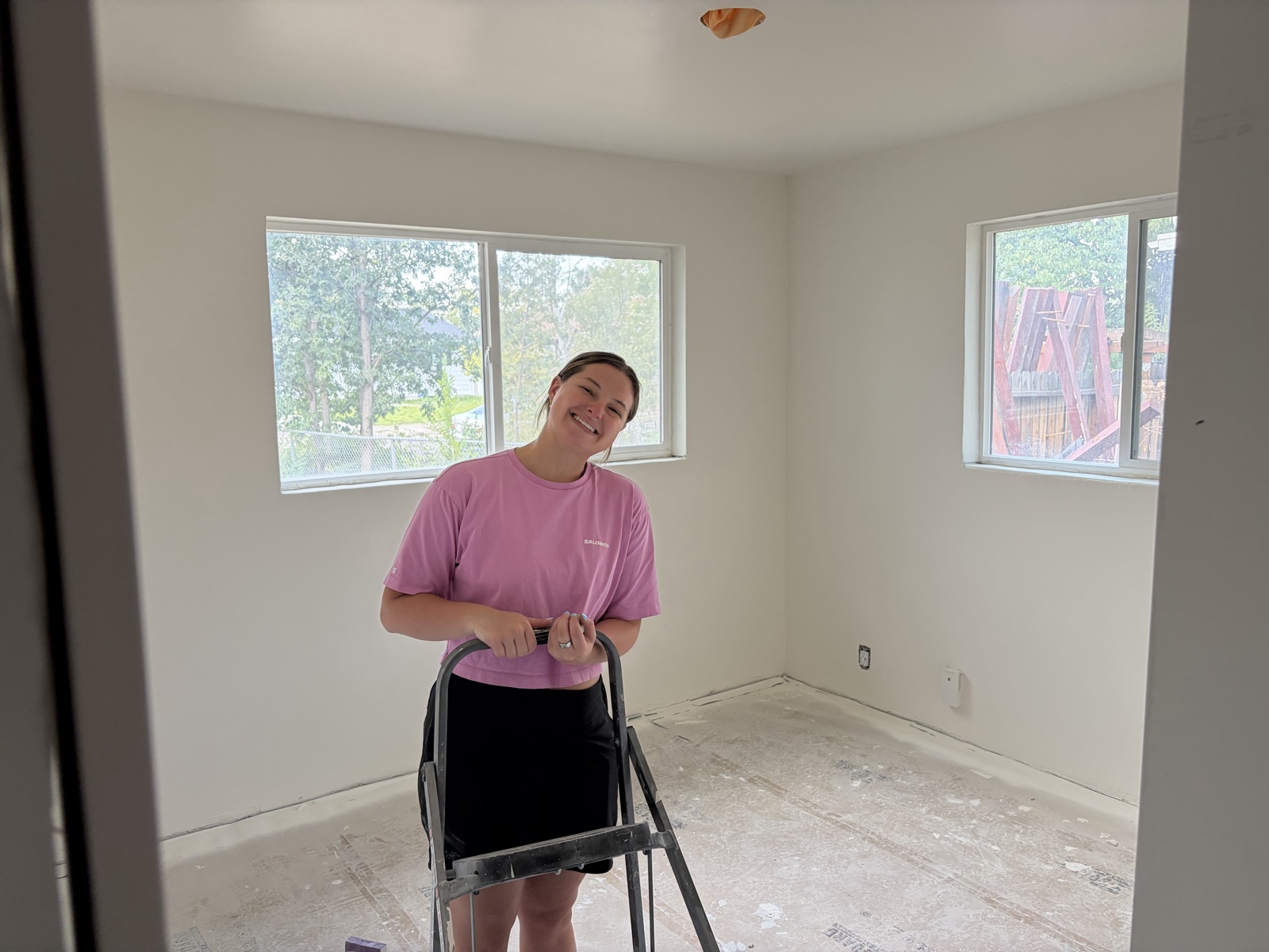 Emma in a freshly painted room