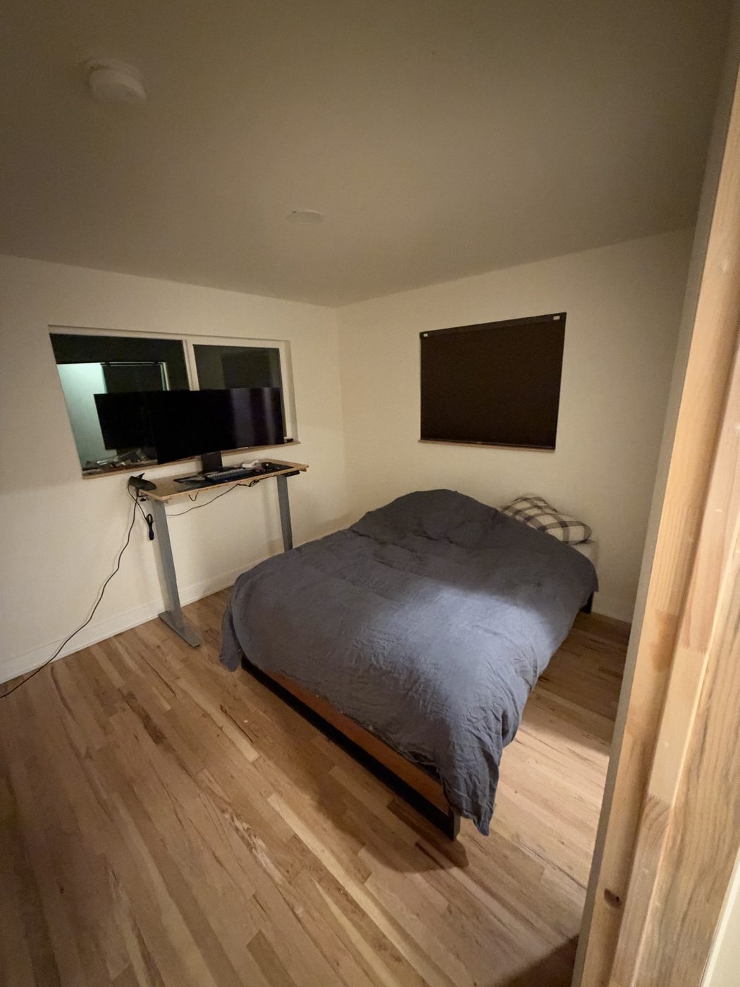 Sep 27, 2026. A bed with a gray comforter in the room for the first night
