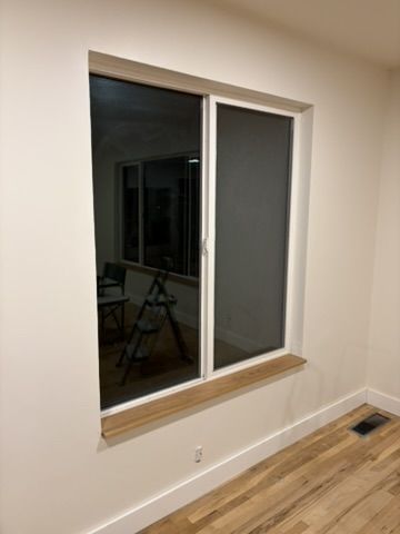 Sep 2, 2026 — Wood window sill and white baseboard trim above the hardwood floor