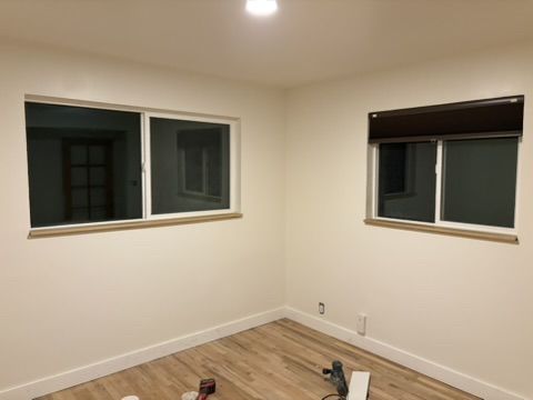Sep 2, 2026 — Two windows with wood sills in a freshly painted room