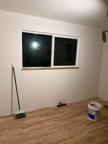 Sep 2, 2026 — Freshly painted room with a wood window sill and hardwood floor