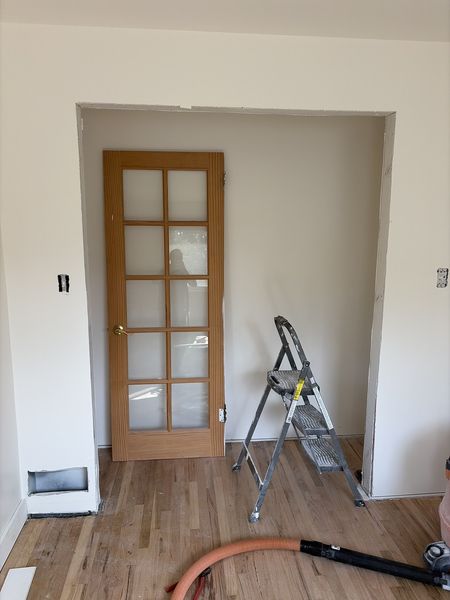 Aug 24, 2026 — Wide doorway and a wood-framed glass door during trim work