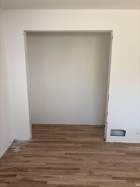Aug 24, 2026 — Wide opening with freshly painted walls and hardwood flooring