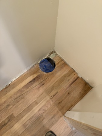 Sep 21, 2026 — Hardwood flooring and a protected round floor opening before trim completion