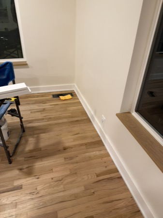 Sep 21, 2026 — Long run of white baseboard and shoe moulding beside a wood window sill
