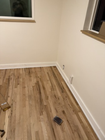 Sep 21, 2026 — Bright room with hardwood flooring, white baseboards, and wood window sills