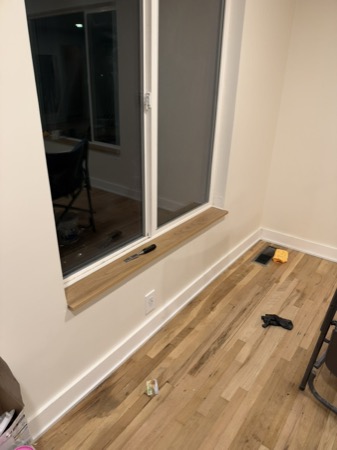 Sep 21, 2026 — Wood window sill, white outlet cover, floor vent, and finished trim