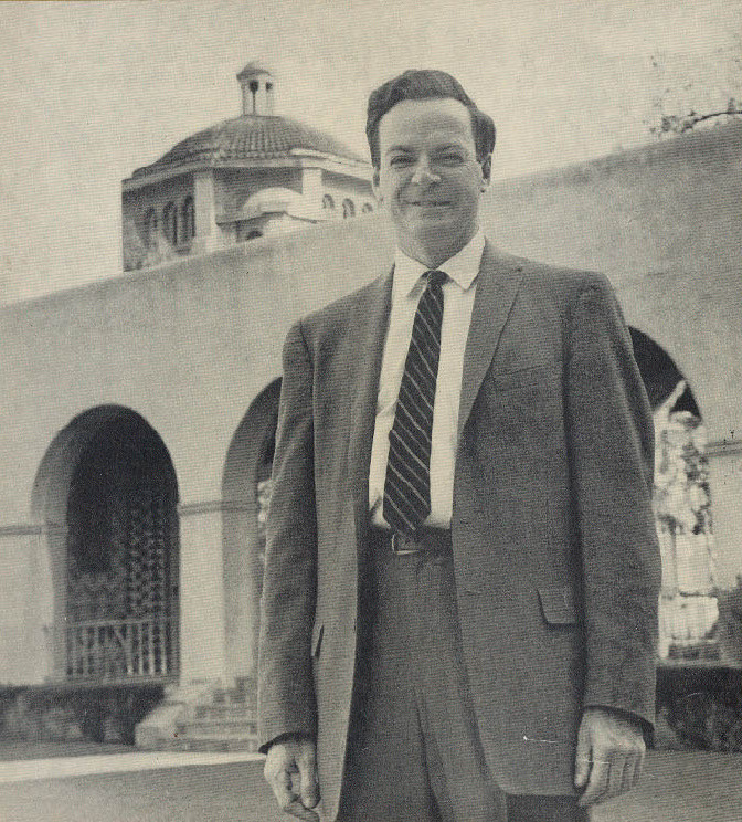 Richard Feynman standing outdoors in a suit, circa 1960.